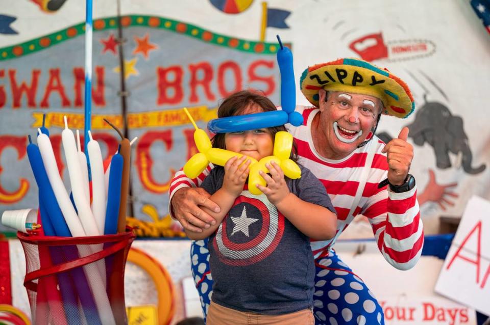 Zippy clowns around with Rafael Sanchez, 5, at the Swan Bros Circus at the Stanislaus County Fair in Turlock, Calif., Friday, July 7, 2023.