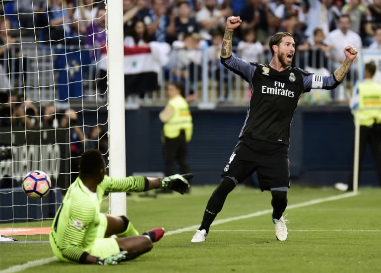 Real Madrid's defender Sergio Ramos celebrates a goal by forward Karim Benzema on May 21, 2017