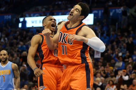 Dec 27, 2015; Oklahoma City, OK, USA; Oklahoma City Thunder guard Russell Westbrook (0) and Oklahoma City Thunder center Enes Kanter (11) celebrate after a play agains tth Denver Nuggets during the fourth quarter at Chesapeake Energy Arena. Mandatory Credit: Mark D. Smith-USA TODAY Sports