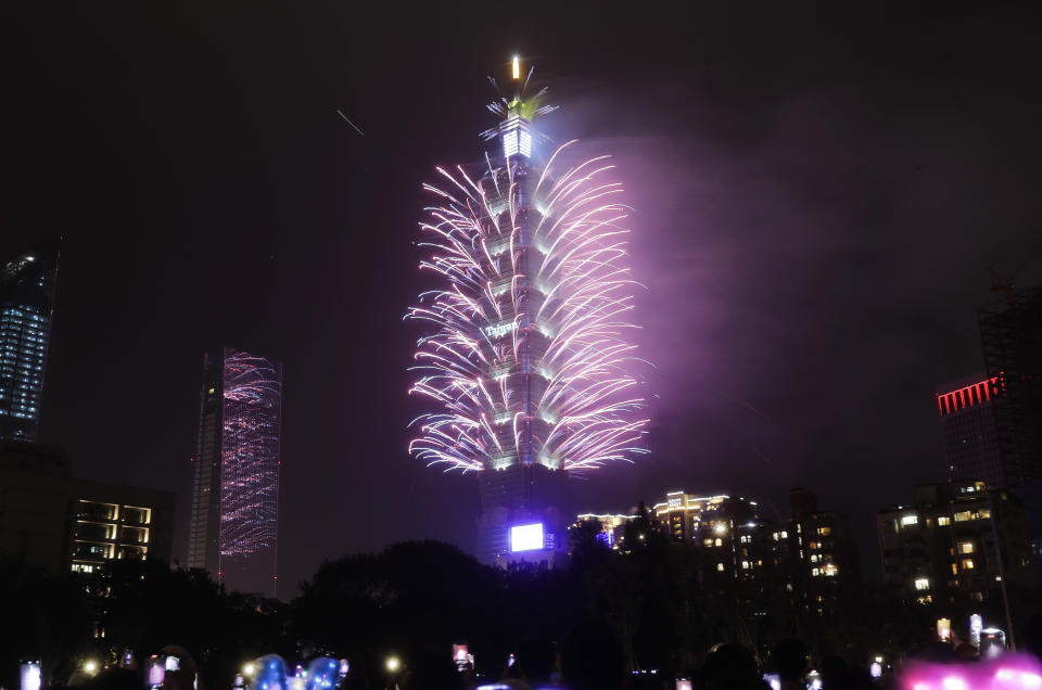 Fireworks explode at the Taipei 101 building during the New Year's celebrations in Taipei, Taiwan, Monday, Jan. 1, 2024. (AP Photo/Chiang Ying-ying)