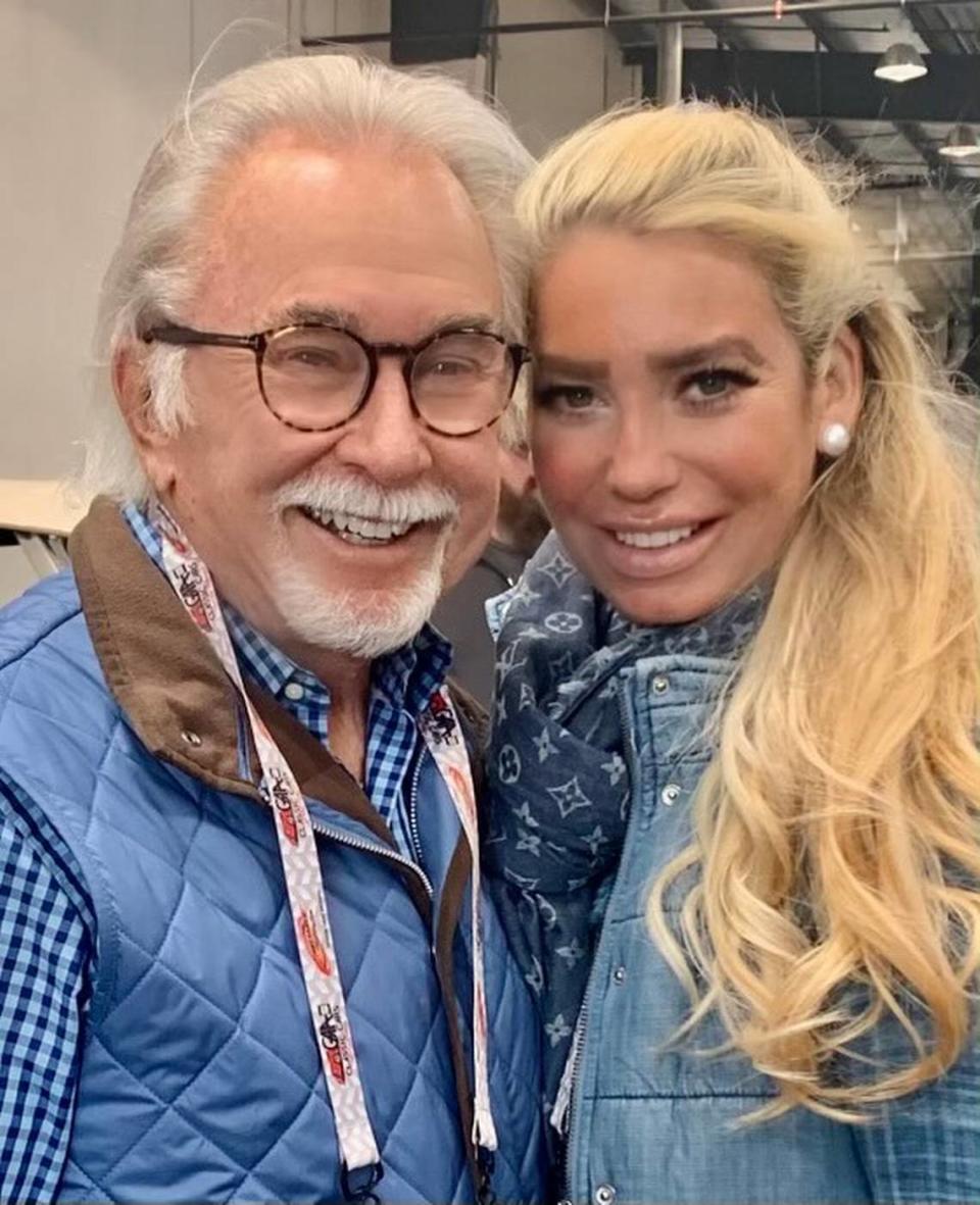 George Shinn (left) and his third wife, Megan Shinn, pose at a recent car show in a photo provided by George Shinn. The two were married in June 2020.