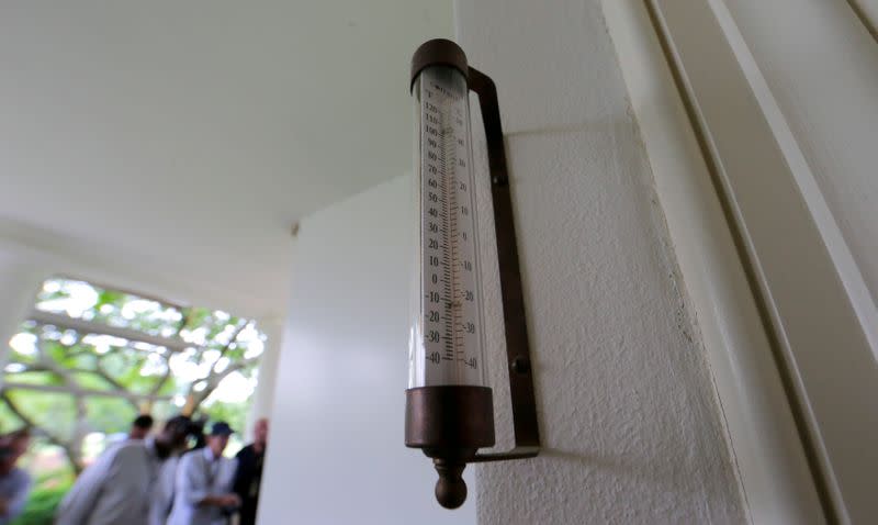 A thermometer is seen mounted just outside the windows of the Oval Office for the President at the White House in Washington