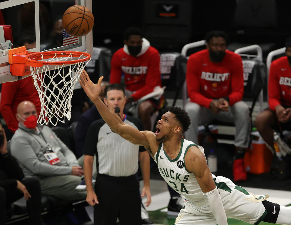 Giannis Antetokounmpo #34 of the Milwaukee Bucks goes up for a shot against Clint Capela #15 of the Atlanta Hawks during the second half in game two of the Eastern Conference Finals at Fiserv Forum on June 25, 2021 in Milwaukee, Wisconsin. NOTE TO USER: User expressly acknowledges and agrees that, by downloading and or using this photograph, User is consenting to the terms and conditions of the Getty Images License Agreement. (Photo by Stacy Revere/Getty Images)