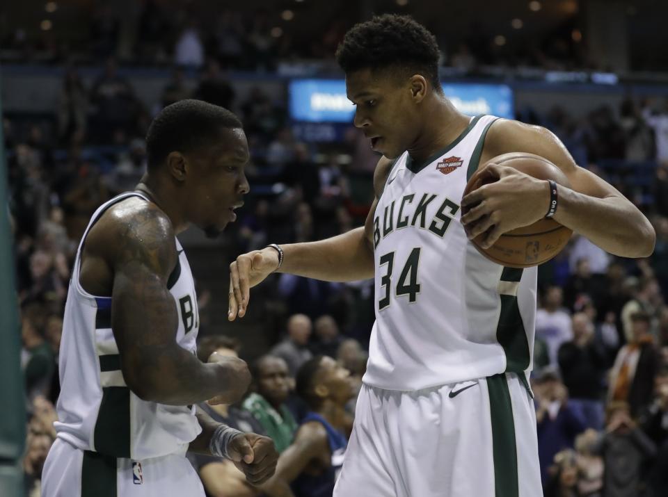 Milwaukee Bucks' Eric Bledsoe and Giannis Antetokounmpo celebrate during the second half of an NBA basketball game against the Minnesota Timberwolves Thursday, Dec. 28, 2017, in Milwaukee. The Bucks won 102-96. (AP Photo/Morry Gash)