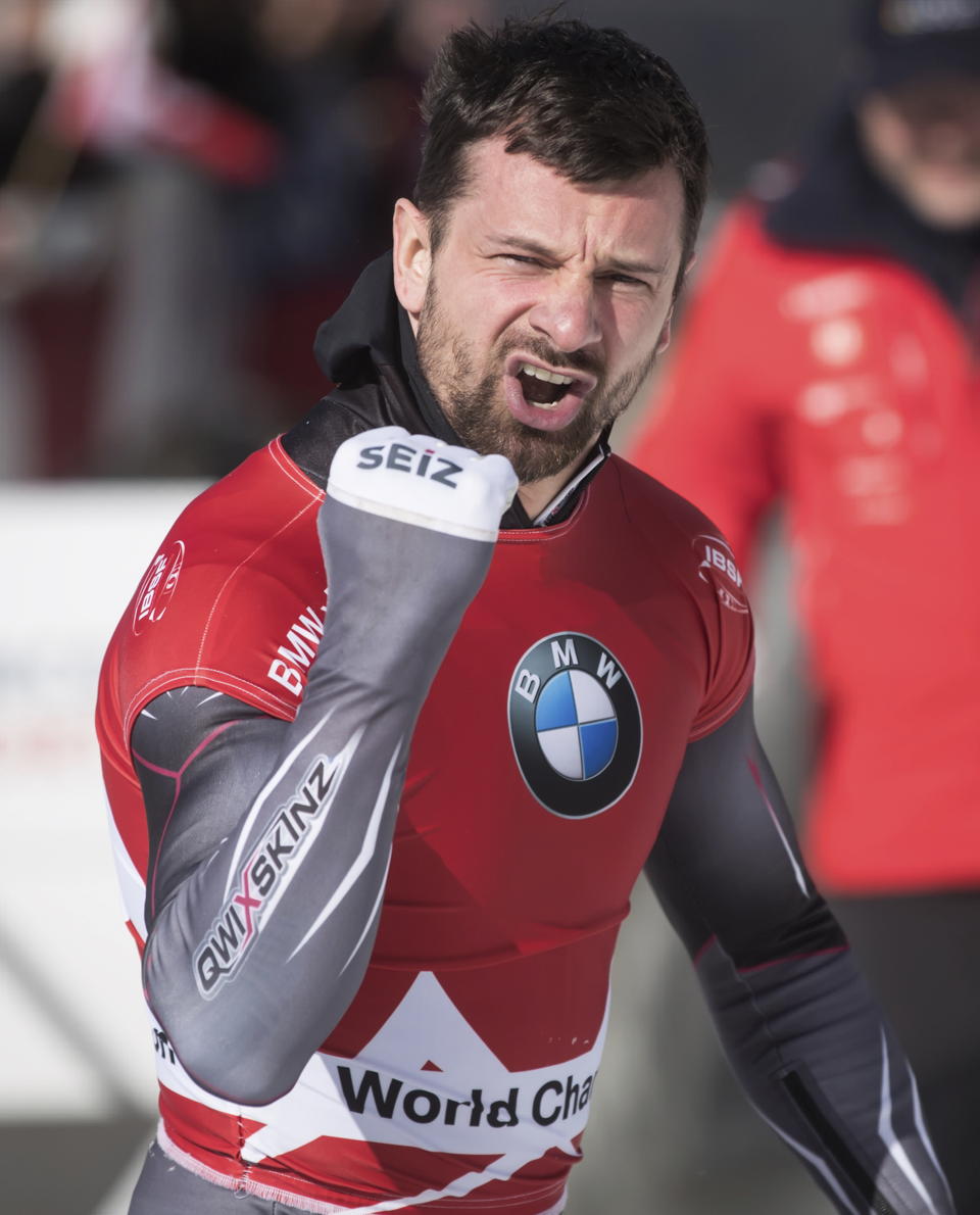 Martins Dukurs, of Latvia, celebrates after winning the men's event at the Skeleton World Championships in Whistler, British Columbia, Friday March 8, 2019. (Darryl Dyck/The Canadian Press via AP)