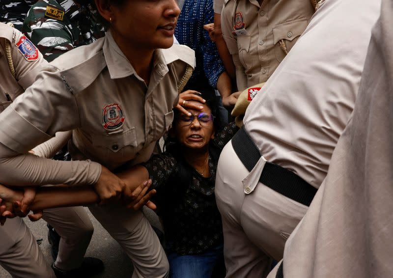 Students holding placards protest outside the Ministry of Education against the cancellation of the UGC-NET examination at New Delhi