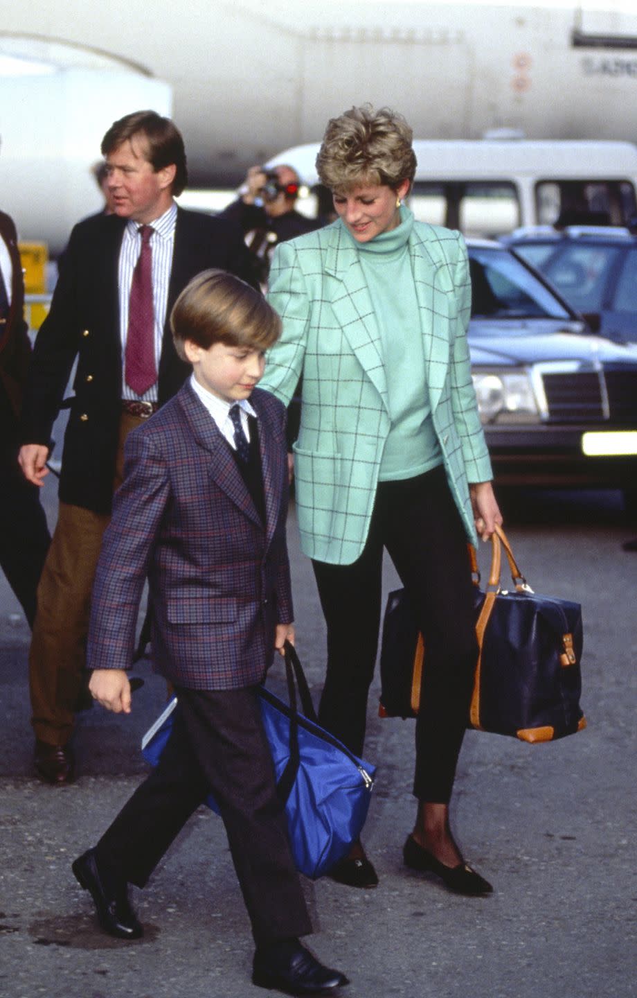 <p>Diana opted for this crisp mint blazer to kick off a ski holiday with Prince William. The mother-son duo was photographed here arriving at Zurich Airport in March 1993.<br></p>