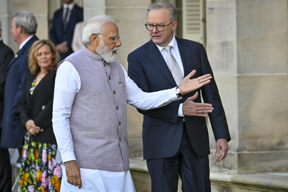 India's Prime Minister Narendra Modi, front left, gestures to Australian Prime Minister Anthony Albanese, following a ceremonial welcome at Admiralty House in Sydney, Australia, Wednesday, May 24, 2023. Modi is the only leader of the so-called Quad nations to continue with his scheduled visit to Australia after U.S. President Joe Biden pulled out of a planned meeting of the group in Sydney to return to Washington to focus on debt limit talks. (Saeed Khan/Pool Photo via AP)