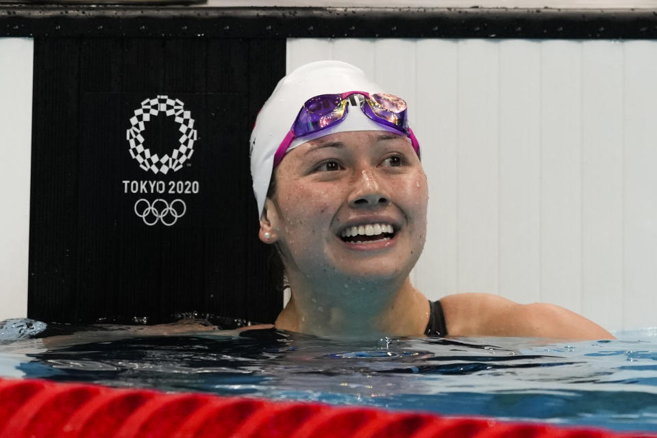 Siobhan Bernadette Haughey, of Hong Kong, reacts after winning the women's 100-meter freestyle semifinal at the 2020 Summer Olympics, Thursday, July 29, 2021, in Tokyo, Japan. (AP Photo/Martin Meissner)