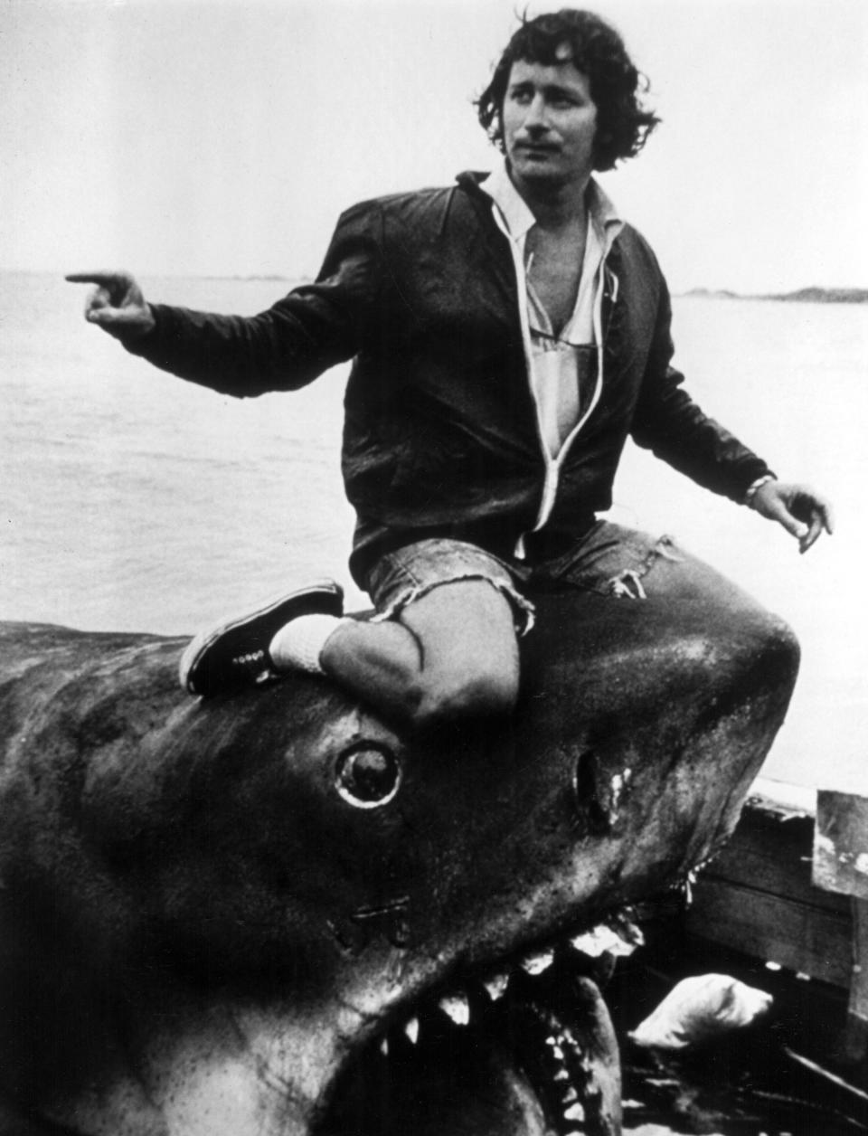 Pictured is Steven Spielberg balancing on the head of Jaws. 