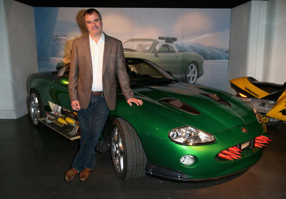 LONDON, ENGLAND - MARCH 18:  Chris Corbould poses in front of the Jaguar XKR from 'Die Another Day' ahead of the opening of the Bond In Motion exhibition at the London Film Museum on March 18, 2014 in London, England. The Exhibition is the largest official collection of original Bond vehicles and opens on the 21st March to the general public.  (Photo by Chris Jackson/Getty Images for London Film Museum)