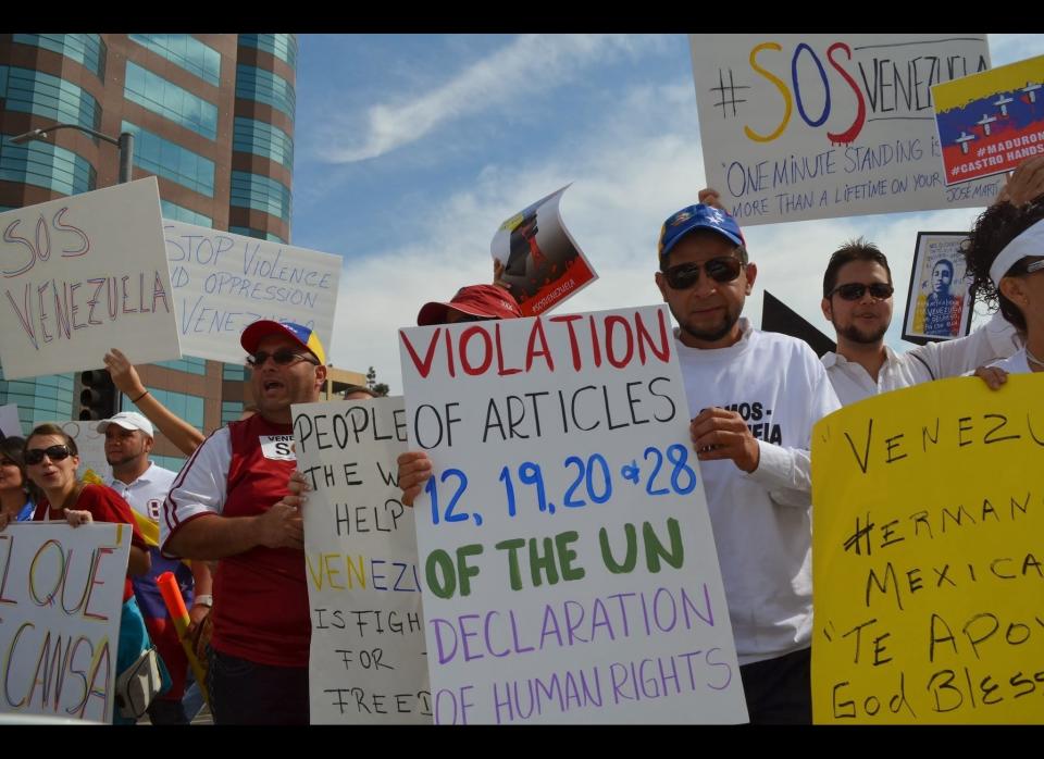 Demonstrators with handmade signs peacefully rally in Los Angeles, California.