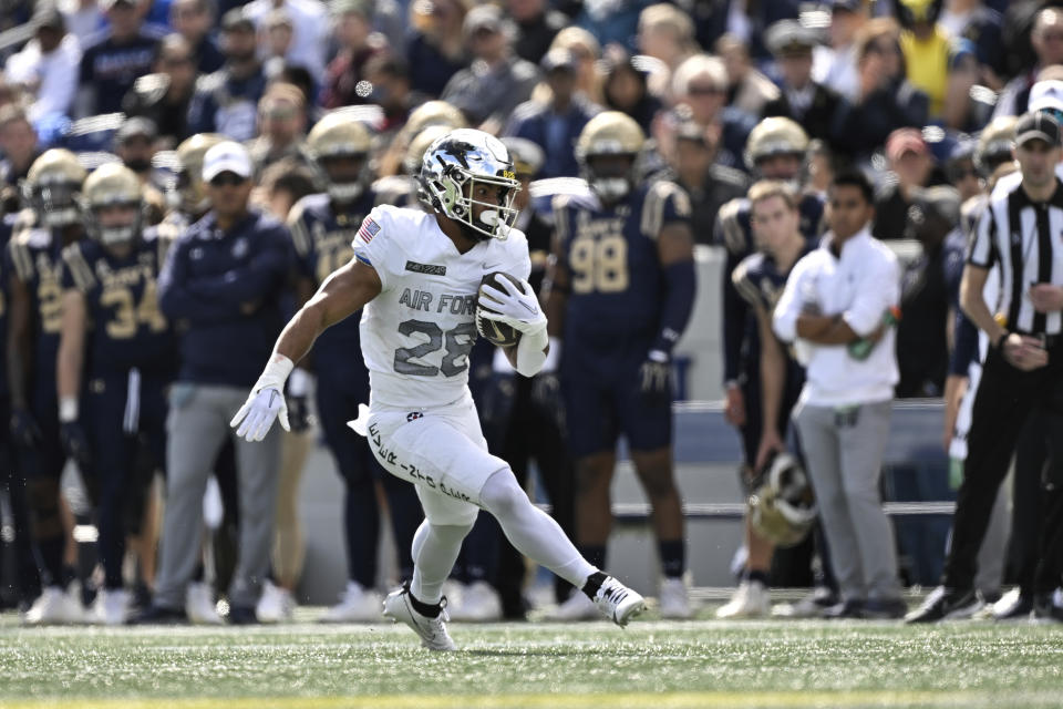 Air Force running back Aiden Calvert (28) runs the ball during the first half of an NCAA college football game against Navy, Saturday, Oct. 21, 2023, in Annapolis, Md. (AP Photo/Terrance Williams)