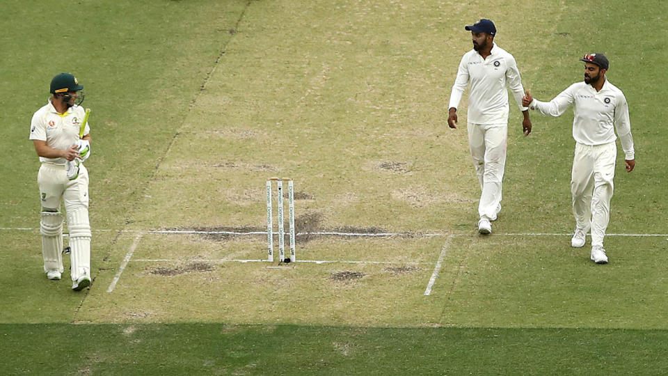 Virat Kohli has words with Tim Paine. (Photo by Ryan Pierse/Getty Images)