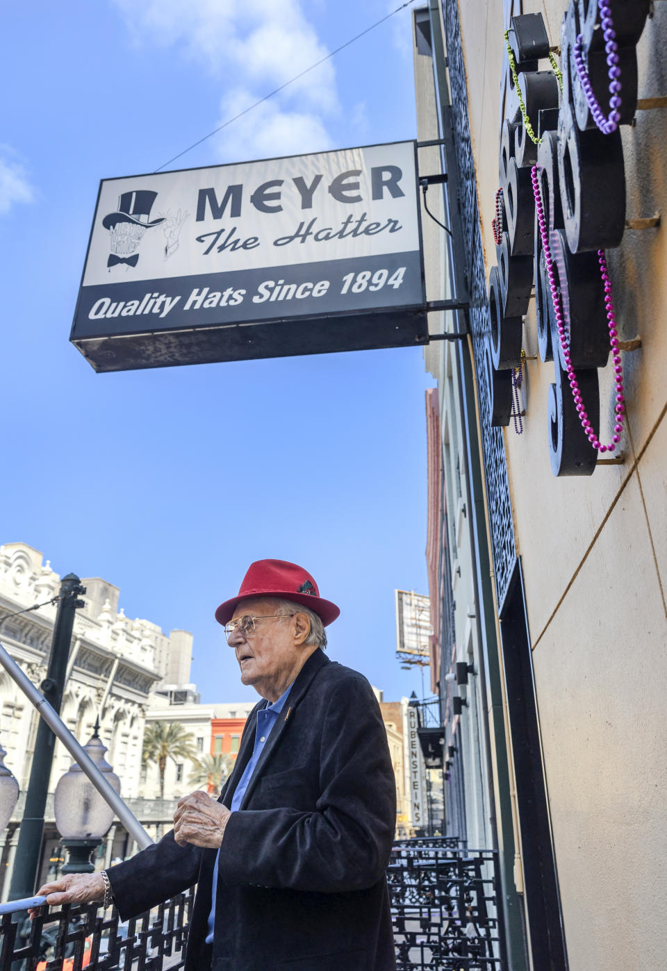 Sam Meyer on the balcony of Meyer the Hatter in downtown New Orleans on Friday, Feb. 23, 2024. Meyer was awarded the rank of chevalier, or knight, of the National Order of the Legion of Honor. (Chris Granger/The Times-Picayune/The New Orleans Advocate via AP)