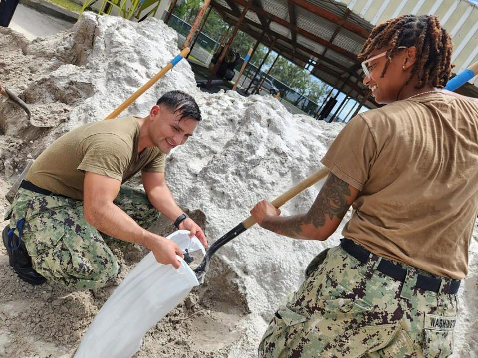 230828-N-YD641-002
JACKSONVILLE, Fla. (Aug. 28, 2023) Culinary Specialist (CS) 2nd Class Juan Rios shovels sand as CS2 Peter Angelade holds the sandbags open to fill at Naval Air Station Jacksonville, Aug. 28. The station has 6,000 bags ready to be filled to help prevent water intrusion from Hurricane Idalia. (U.S. Navy photo by Mass Communications Specialist 2nd Class Matthew Riggs/Released)