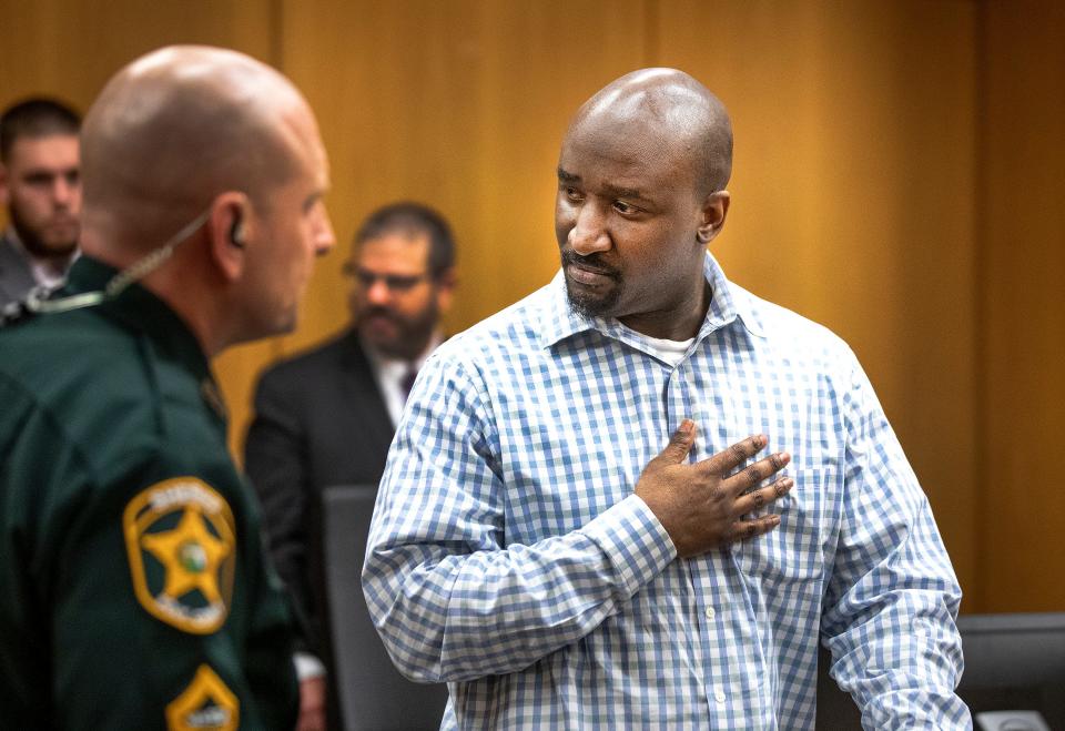 Marcelle Jerrill Waldon clasps his hand against his chest as he looks at family members as he is led out of the courtroom after a jury found him guilty of 2 counts of first degree murder in the deaths of Edie Yates Henderson and her husband David Henderson in court in Bartow Fl. Wednesday January 31,2024. Waldon faces a possible death penalty sentence for the murders.
Ernst Peters/The Ledger