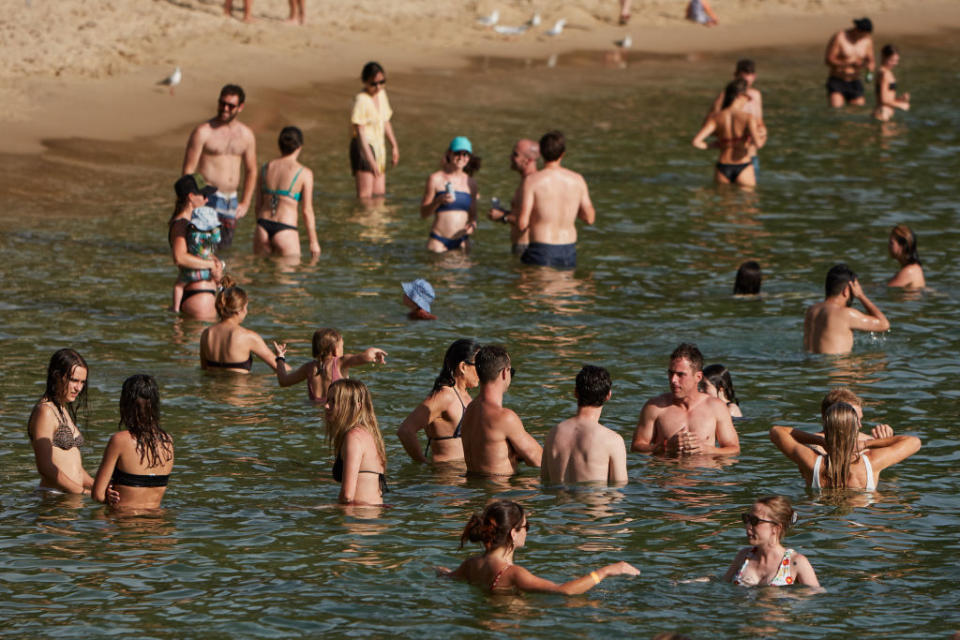 People are seen enjoying the warm weather at Manly Wharf on November 28, 2020 in Sydney, Australia. 