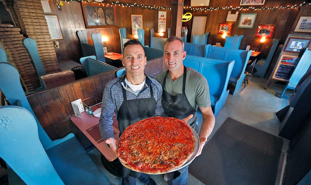 Brothers Mark and Jeremy Caruso with a "Monster Pizza" at Denly Gardens in Weymouth last year.