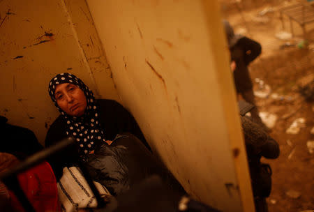 Iraqi woman sits in an army lorry after she flees the Islamic State stronghold of Mosul in al-Samah neighborhood, Iraq December 2, 2016. REUTERS/Mohammed Salem