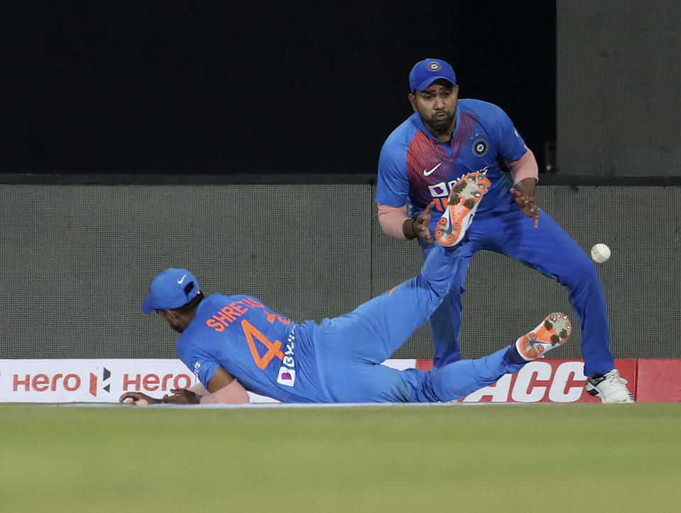 India's Rohit Sharma, right, reacts as teammate Shreyas Iyer, left, drops a catch after a shot played by West Indies' Nicholas Pooran during the second Twenty20 international cricket match between India and West Indies in Thiruvanathapuram, India, Sunday, Dec. 8, 2019. (AP Photo/Aijaz Rahi)