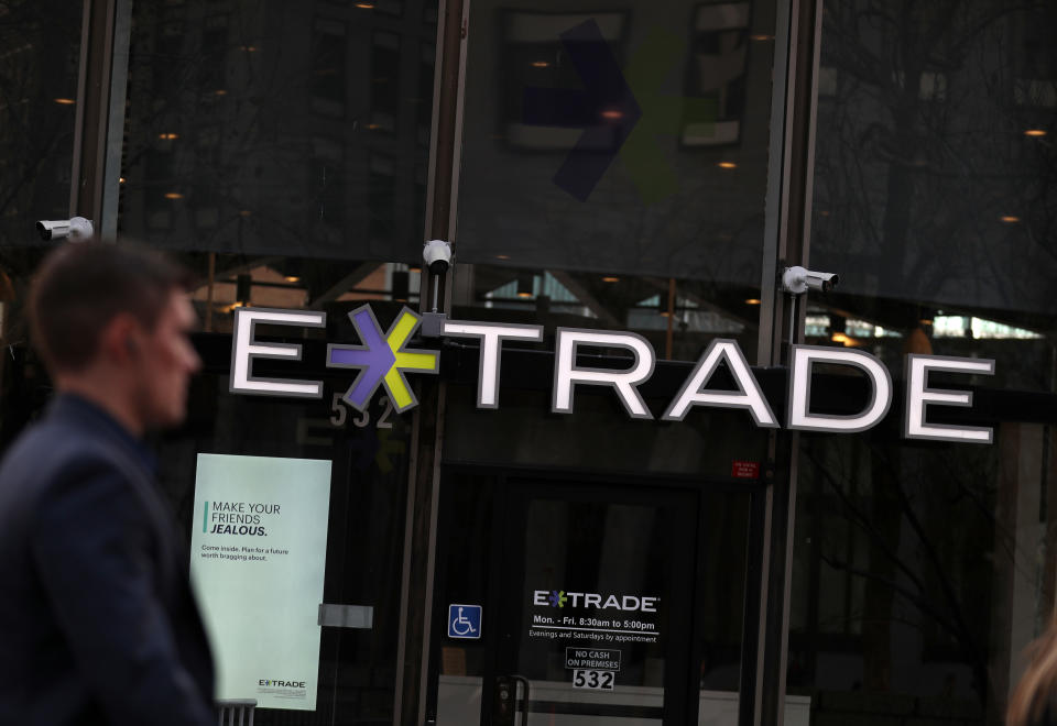 SAN FRANCISCO, CALIFORNIA - FEBRUARY 20: A pedestrian walks by an E*Trade office on February 20, 2020 in San Francisco, California. Morgan Stanley announced plans to buy online discount brokerage E*Trade in an estimated $13 billion all-stock deal. (Photo by Justin Sullivan/Getty Images)