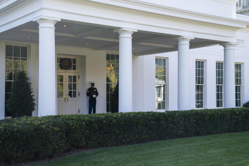 A Marine is posted outside the West Wing of the White House, signifying the President is in the Oval Office, Thursday, Nov. 5, 2020, in Washington. (AP Photo/Evan Vucci)