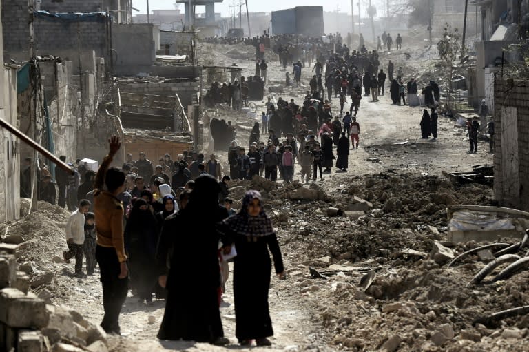 In war-torn west Mosul, seized this week by Iraqi forces, hundreds of residents finally received food aid