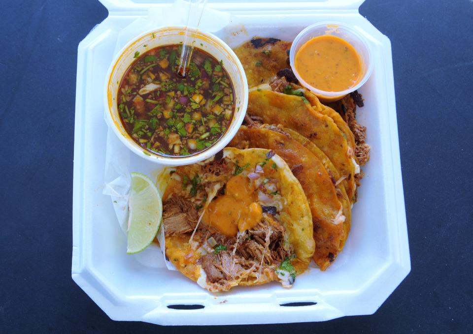 Quesabirria tacos served with homemade broth, hot creamy salsa and a wedge of lime at the Taqueria Vargas food truck on Wednesday, Aug. 11, 2021.