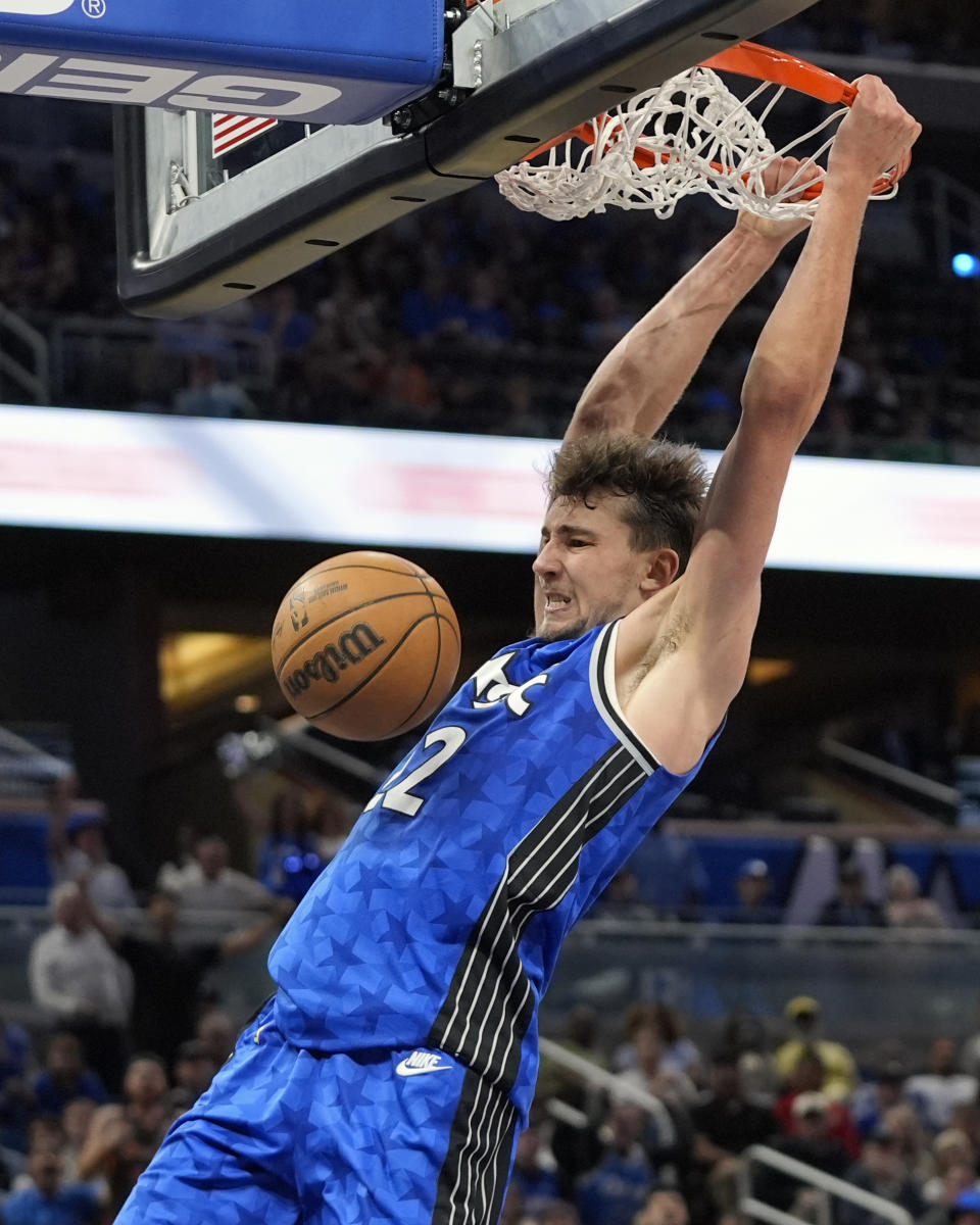 FILE - Orlando Magic forward Franz Wagner dunks during the second half of an NBA basketball game against the Milwaukee Bucks, Sunday, April 14, 2024, in Orlando, Fla. Franz Wagner has agreed to the largest contract in Orlando Magic history, a five-year extension that will be worth at least $224 million, a person with knowledge of the negotiations told The Associated Press on Friday, July 5, 2024. (AP Photo/John Raoux, File)