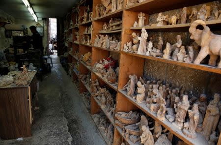 Figurines carved by Palestinian workers for sale during Christmas season, are seen in a workshop in Bethlehem in the occupied West Bank, December 10, 2018. REUTERS/Raneen Sawafta