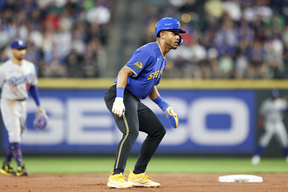Seattle Mariners' Julio Rodriguez looks on after stealing second base after a wild pitch from Los Angeles Dodgers starting pitcher Bobby Miller during the first inning of a baseball game Friday, Sept. 15, 2023, in Seattle. (AP Photo/Maddy Grassy)