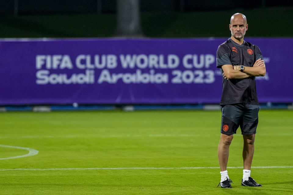 Manchester City's head coach Pep Guardiola looks on during a training session at the King Abdullah Sports City Stadium in Jeddah, Saudi Arabia, Thursday, Dec. 21, 2023. Manchester City will play against Fluminense during the final soccer match of the Club World Cup on Friday Dec. 21. (AP Photo/Manu Fernandez)