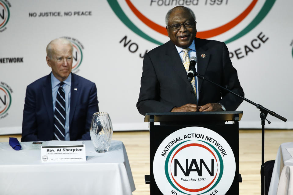 Democratic presidential candidate former Vice President Joe Biden, listens to Rep. James Clyburn, D-S.C., speak at the National Action Network South Carolina Ministers' Breakfast, Wednesday, Feb. 26, 2020, in North Charleston, S.C. (AP Photo/Matt Rourke)