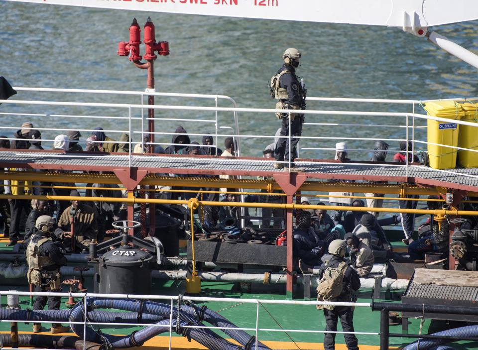 Armed forces stand onboard the Turkish oil tanker El Hiblu 1, which was hijacked by migrants, in Valletta, Malta, Thursday March 28, 2019. A Maltese special operations team on Thursday boarded a tanker that had been hijacked by migrants rescued at sea, and returned control to the captain, before escorting it to a Maltese port. (AP Photo/Rene' Rossignaud)