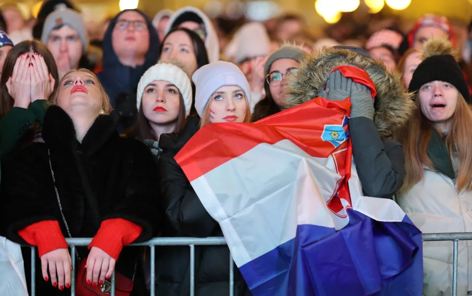 Soccer Football - FIFA World Cup Qatar 2022 - Fans in Zagreb watch Argentina v Croatia - Zagreb, Croatia - December 13, 2022 Croatia fans react at the Ban Josip Jelacic Square after Argentina's Lionel Messi scores their first goal REUTERS/Antonio Bronic