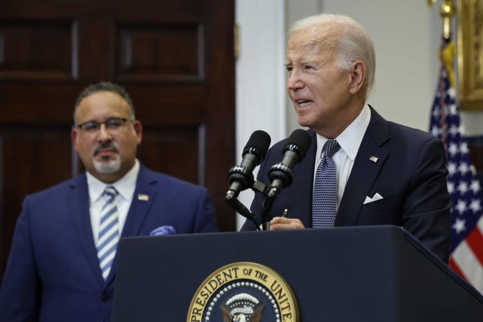 (Left to right) Education Secretary Miguel Cardona and U.S. President Joe Biden in the Roosevelt Room at the White House on June 30, 2023 as Biden announces new actions to assist borrowers in the wake of the Supreme Court striking down his student loan forgiveness plan. (Photo by Chip Somodevilla/Getty Images)