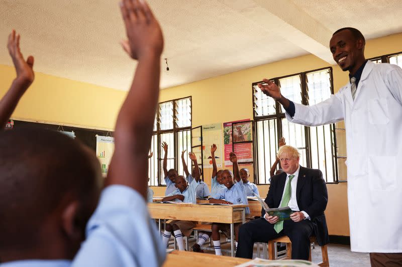 British PM Johnson visits school as heads of government from Commonwealth nations meet in the Rwandan capital Kigali