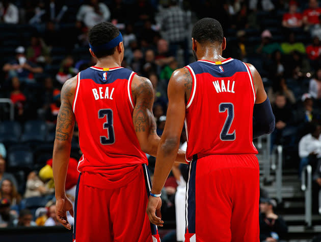 Bradley Beal and John Wall hash it out. (Getty Images)