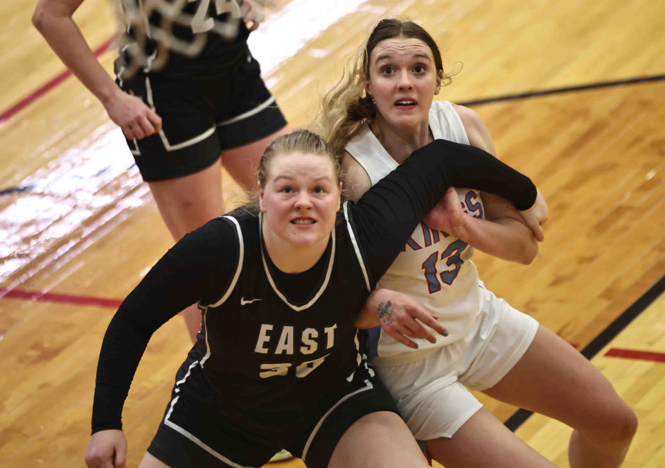 Kings forward Elise Marchal (13) battles Lakota East's Payton Woody (33) for rebound position during the OHSAA Division I regional semifinal game Wednesday, March 1, 2023.