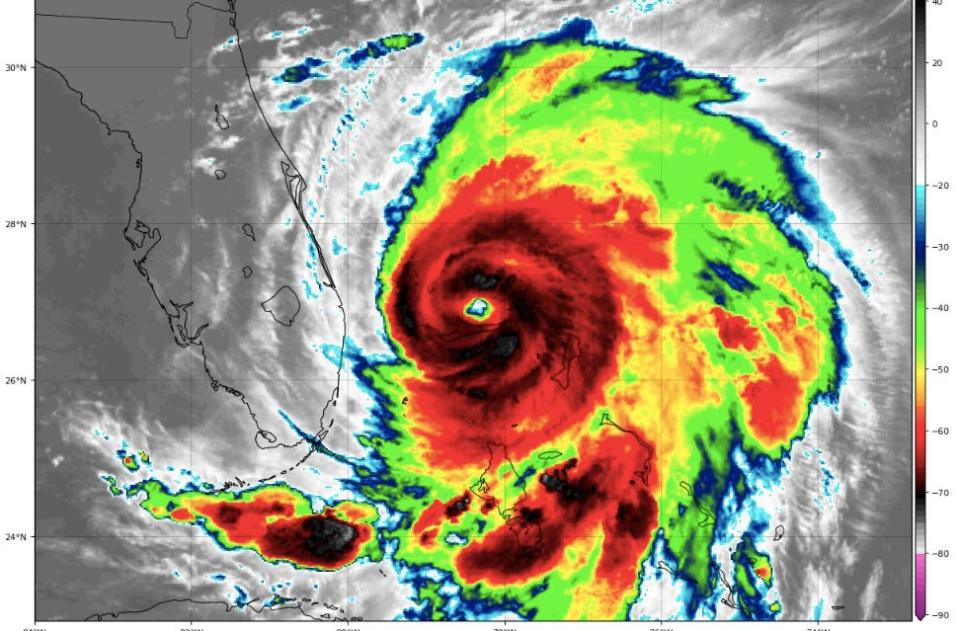 brightly colored satellite imagery shows Hurricane Dorian moving toward florida