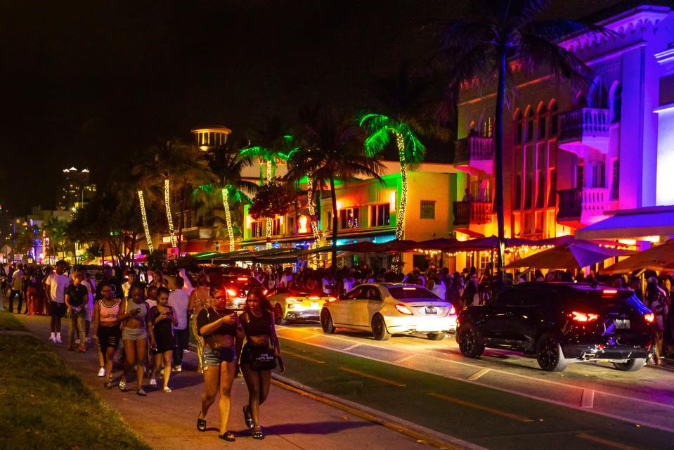 Crowds fill the sidewalks along Ocean Drive during Spring Break in Miami Beach, Fla., on Sunday.