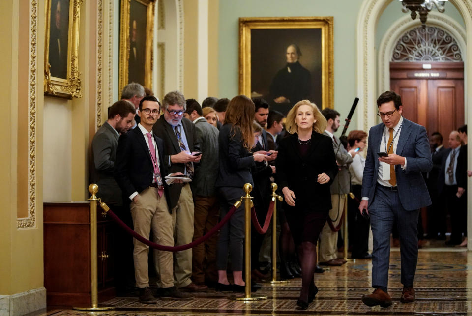 Senator Gillibrand walks during a break in the impeachment trial in Washington.