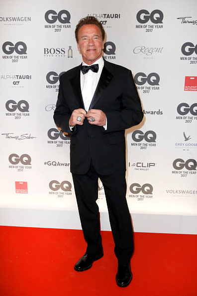 <p>Schwarzenegger arrived at <em>GQ</em>‘s Men Of The Year Awards like a cover star in his tailored black tux. (Image via Getty) </p>