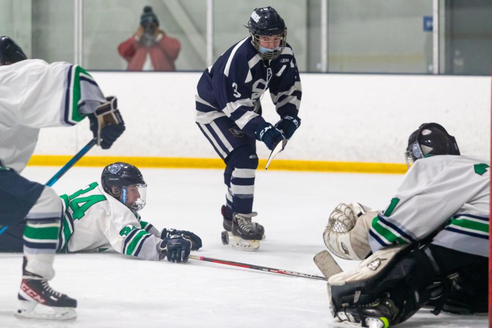 Somerset Berkley’s Davis Sullivan takes a chance on net through the defense of Dighton-Rehoboth/Seekonk on Wednesday. 