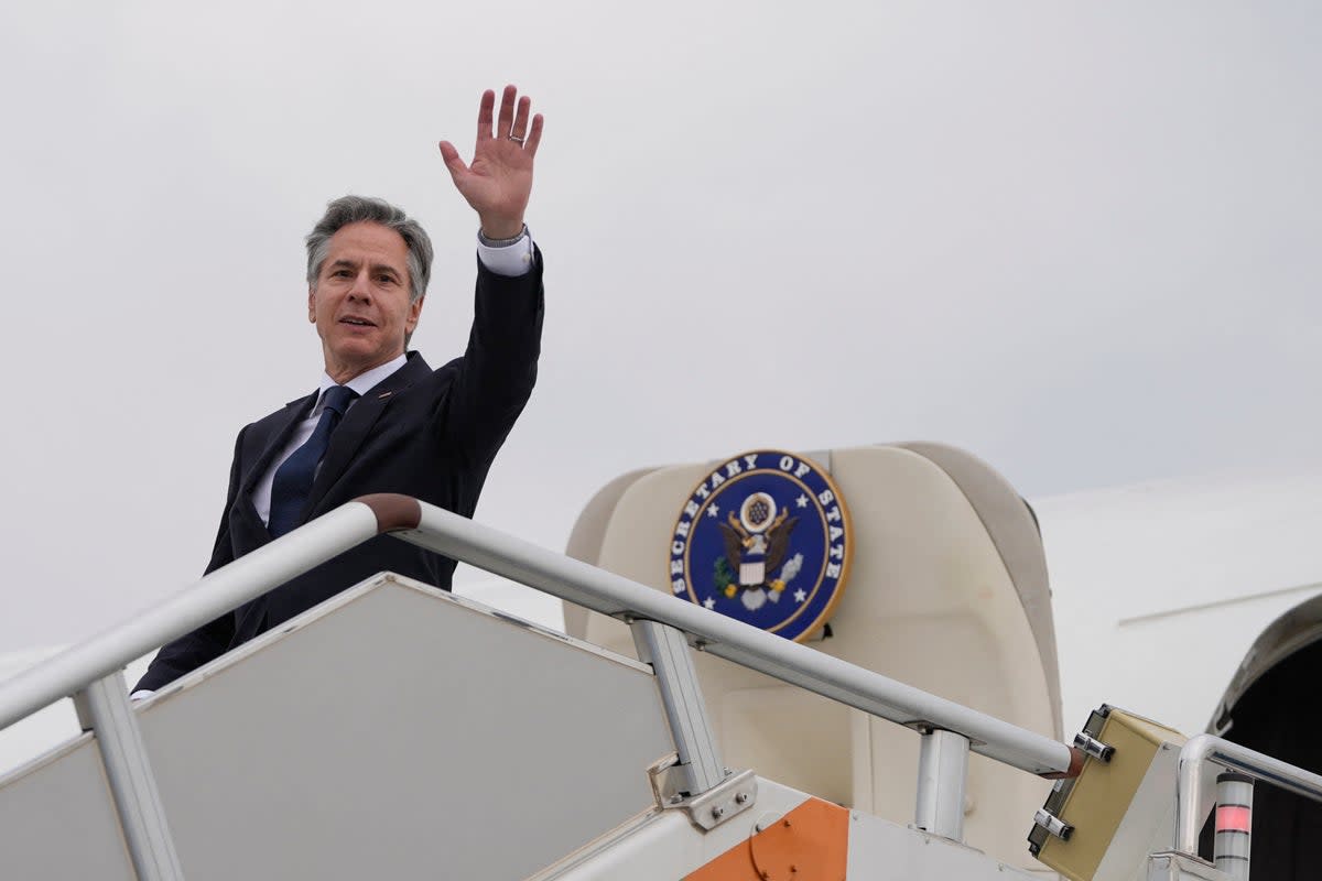 US Secretary of State Antony Blinken waves as he prepares to depart Shanghai Hongqiao International Airport en route to Beijing (POOL/AFP via Getty Images)