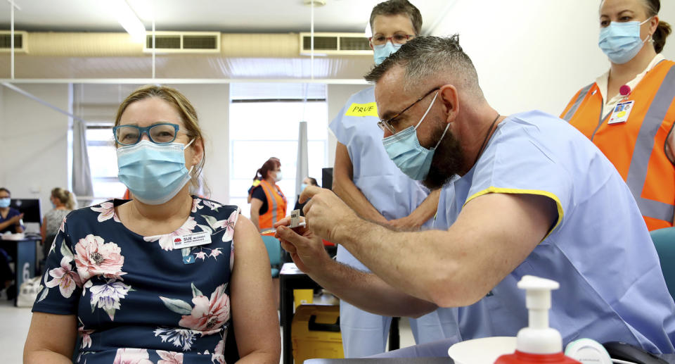 Nurse manager Sue McGrady receives the Pfizer vaccine at the Royal Prince Alfred Hospital Vaccination Hub in Sydney