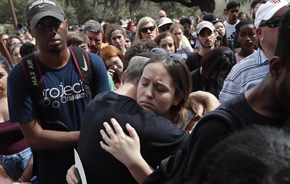 Ashira Boxman hugs her father, Rabbi Bradd Boxman of Congregation Kol Tikvah, which lost three members in last Wednesday's mass shooting (AP)