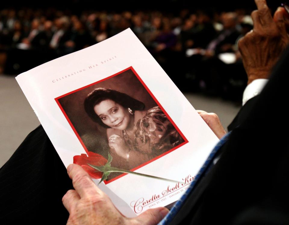 LITHONIA, GA - FEBRUARY 7:  A guest holds a program at funeral services for Coretta Scott King on February 7, 2006 at the New Birth Missionary Baptist Church in Lithonia, Georgia. Coretta Scott King, the wife of slain civil rights leader Martin Luther King Jr., died January 30 at the age of 78.  (Photo by Ozier Muhammad-Pool/Getty Images)