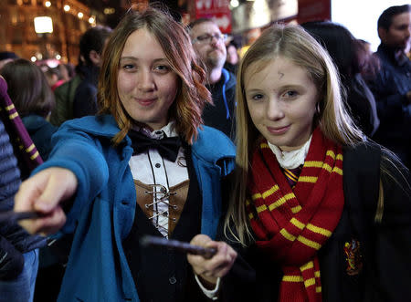 People gather for a global fan event to preview the film "Fantastic Beasts and Where to Find Them" at Cineworld IMAX at Leicester Square in London, Britain October 13, 2016. REUTERS/Neil Hall